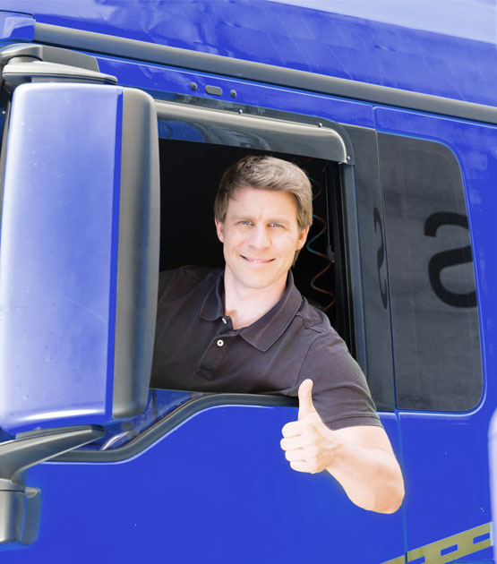 A person giving thumbs up while on a blue truck.